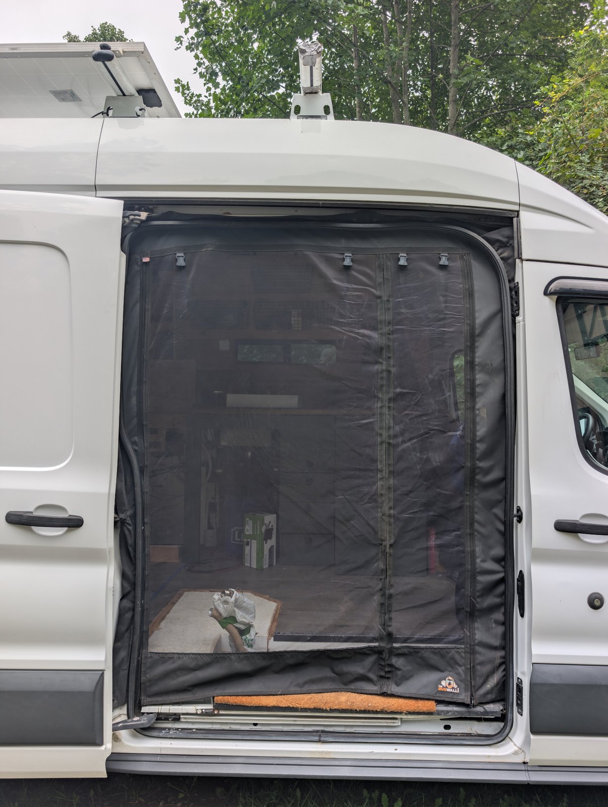 The Bug Wall screen fitted across the open sliding side door