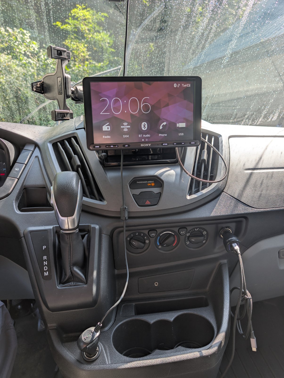 The Sony XAV-AX8000 head unit on the dash, floating screen above the factory climate controls