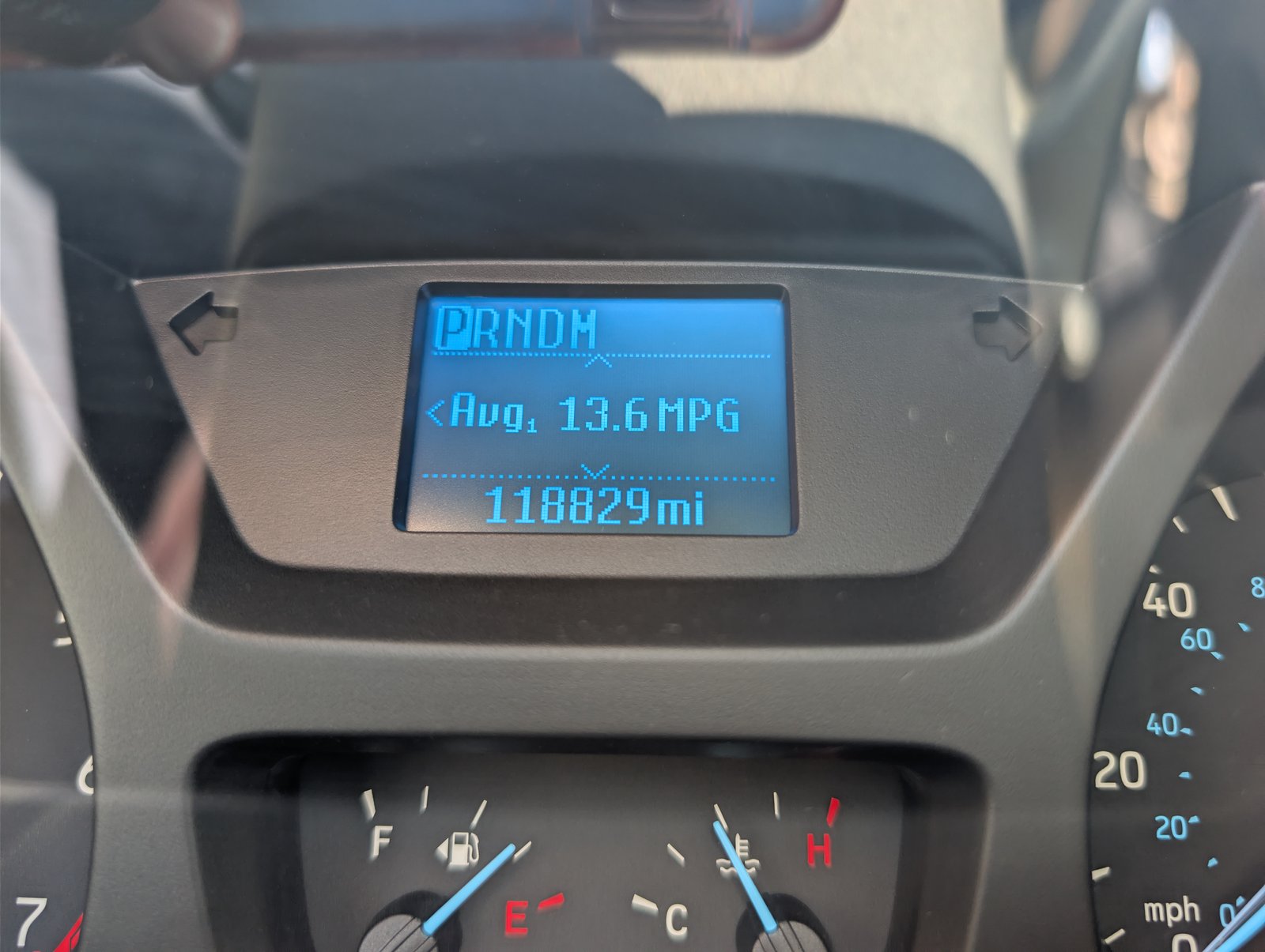 Trip computer showing 13.6 MPG average and 118,829 miles