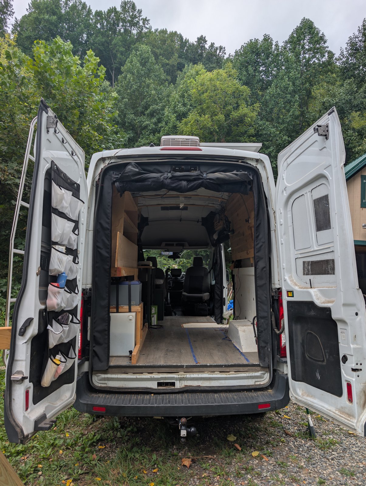 Rear doors open, showing the Surco ladder, tow hitch and door storage organisers